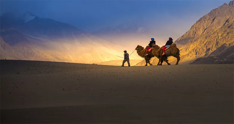 Couple enjoying Camel Safari in Ladakh Image